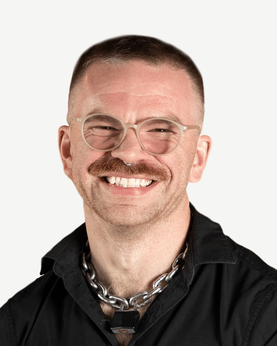 Headshot of a smiling developer with glasses and a mustache, an expert providing custom mobile app development services.